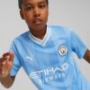 _77044101 Maglia-gara-Manchester-City-F.C d Maglia replica Manchester City FC Home 23/24 Junior