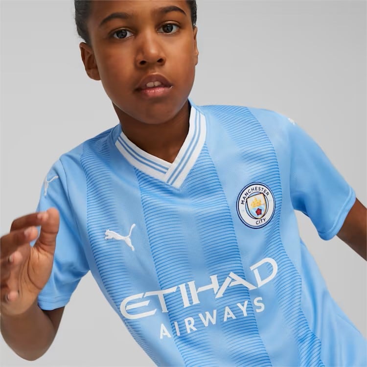 _77044101 Maglia-gara-Manchester-City-F.C d Maglia replica Manchester City FC Home 23/24 Junior