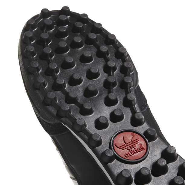 Scarpa da calcetto Mundial Team di Adidas tomaia in suede e pelle fodera in materiale sintetico Intersuola sagomata in EVA La suola in gomma TF